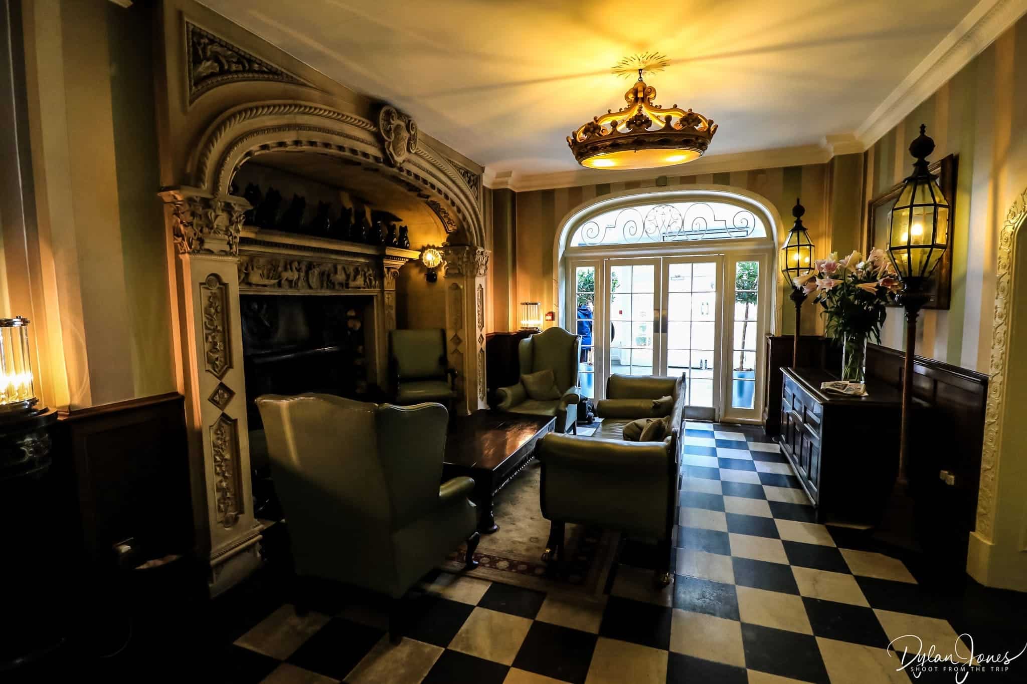The grand Italian fireplace within the main hall of the Portmeirion Hotel