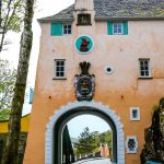 An archway passing through the pastel coloured Bridge House at Portmeirion Village