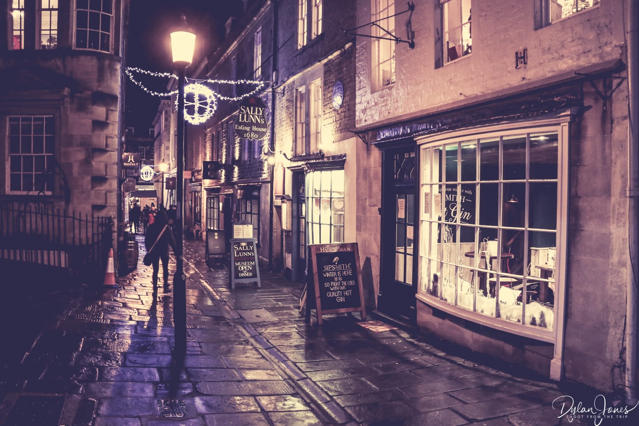 A night time photograph of North Parade in Bath with a very Dickensian feel at the Bath Christmas Market