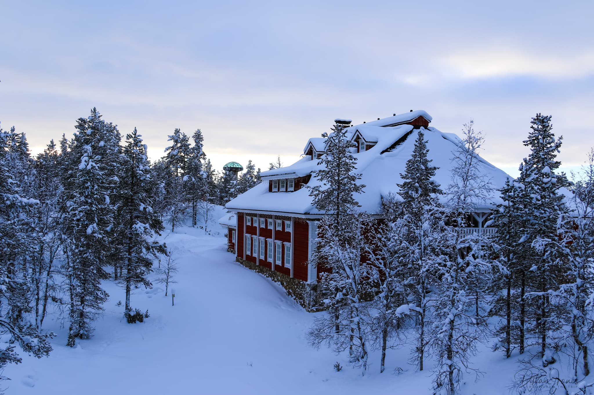 The Celebration House and the new Glass Igloo observation tower in the background at Kakslauttanen West Village