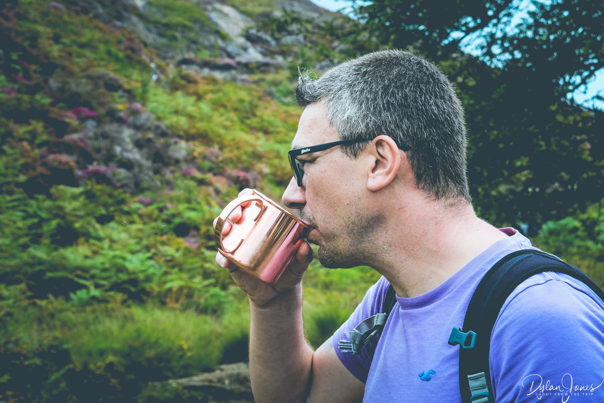 Pete sampling the mountain stream water during our walk in Snowdonia