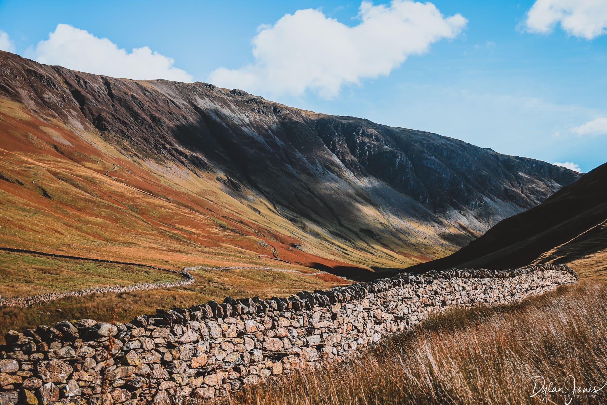 A stone wall and the valley of Honister Pass