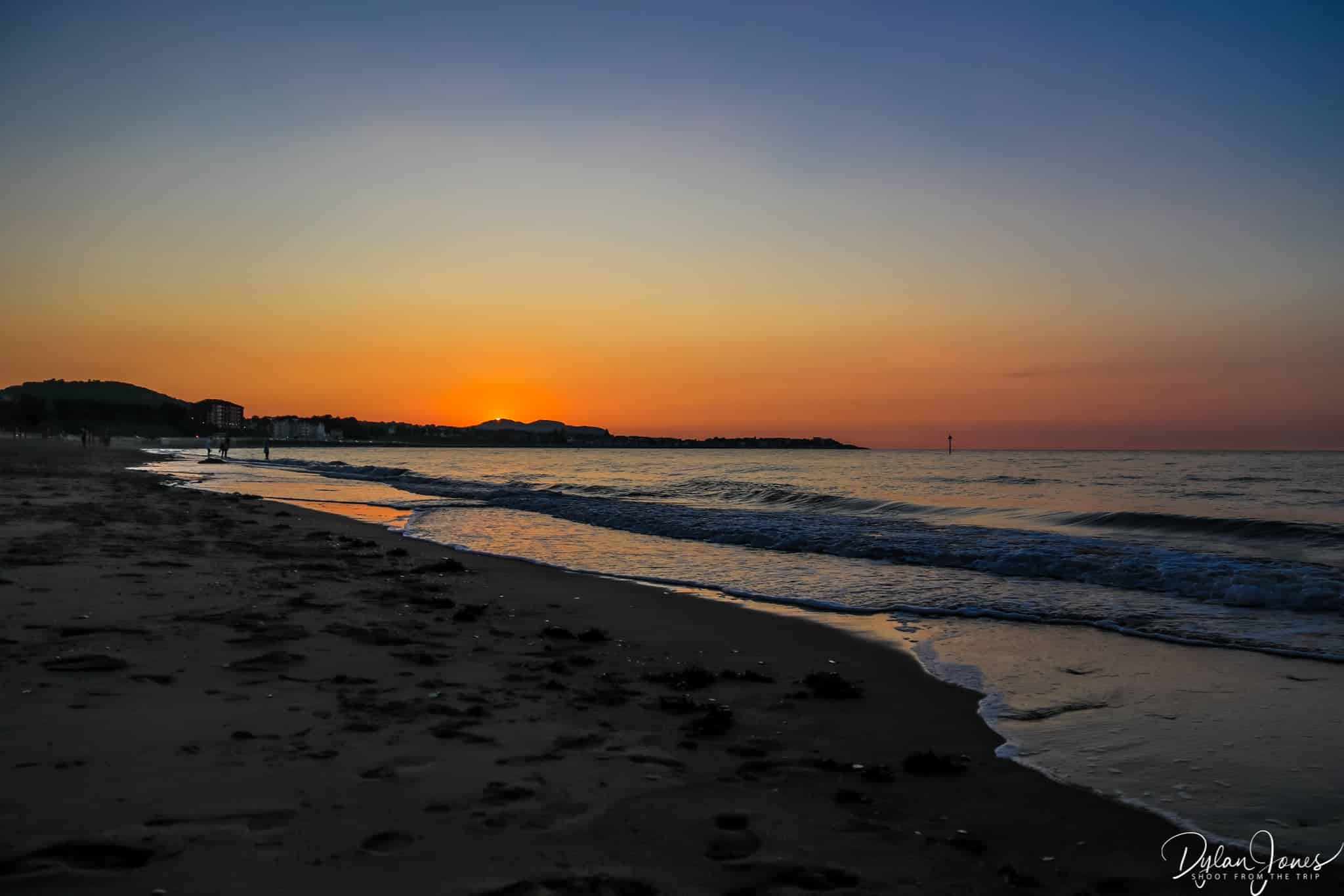 The sun setting over Little Orme
