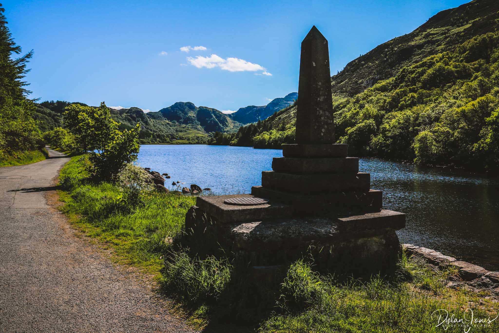 Lakeside monument and Carneddau backdrop