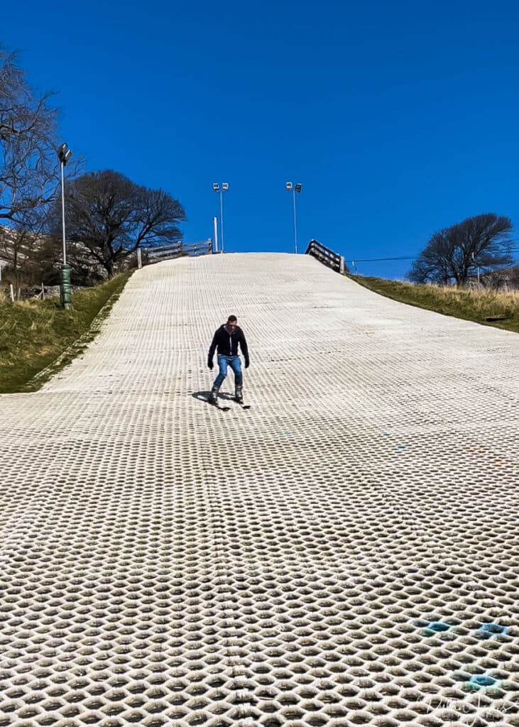 A shot of Dylan skiing on the dry slope at Llandudno Snowsports Centre