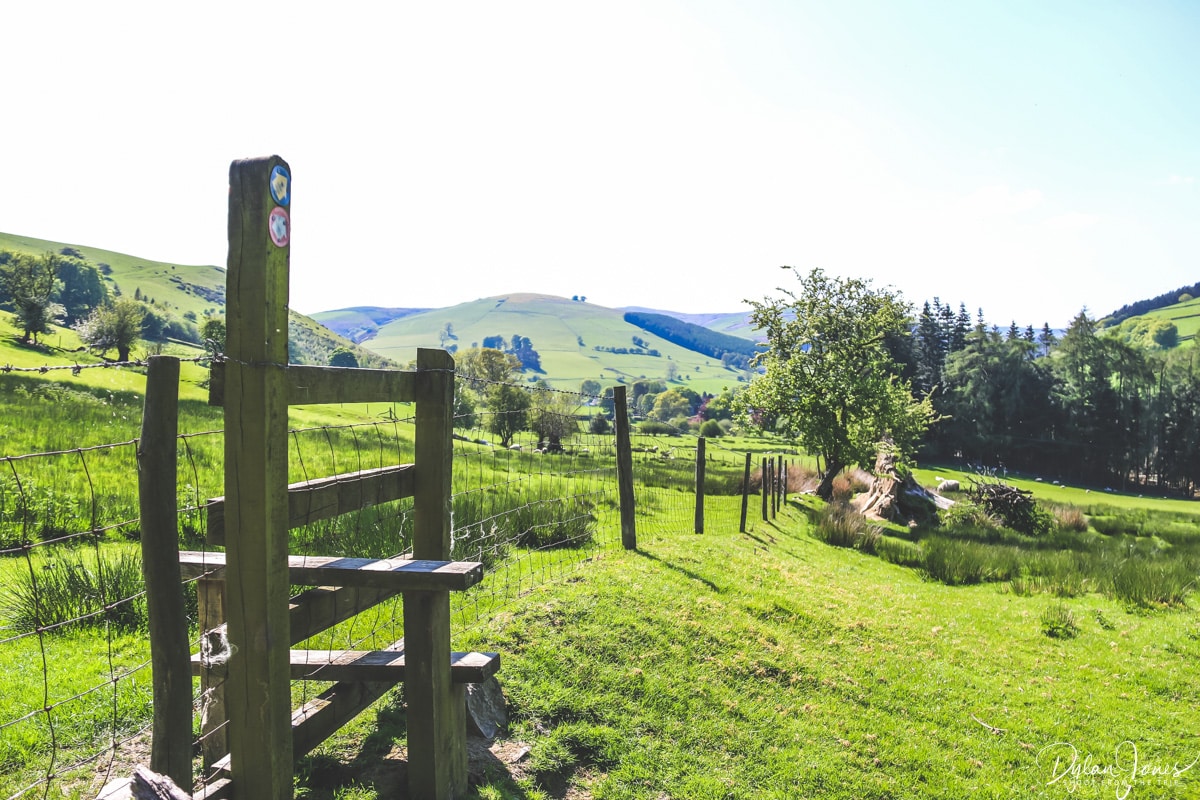 A footpath leading through fields in the Ceiriog Valley