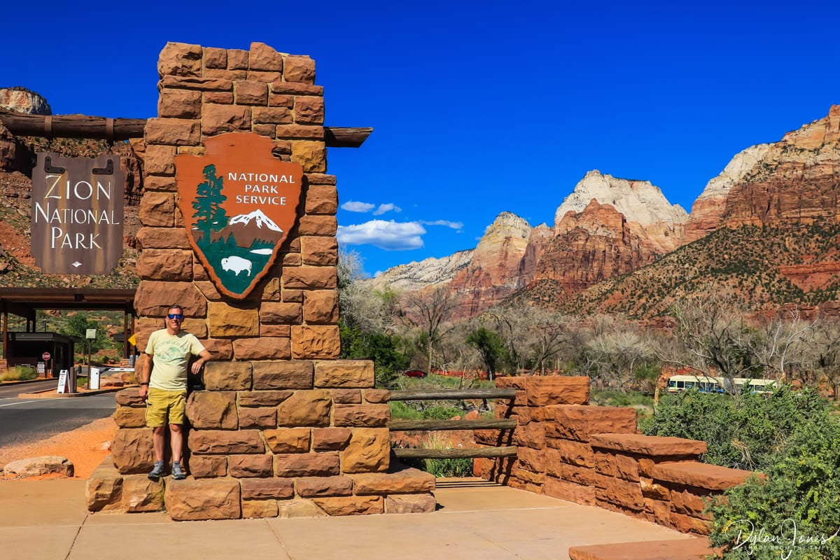 Visiting the Zion National Park entrance sign on a Utah road trip